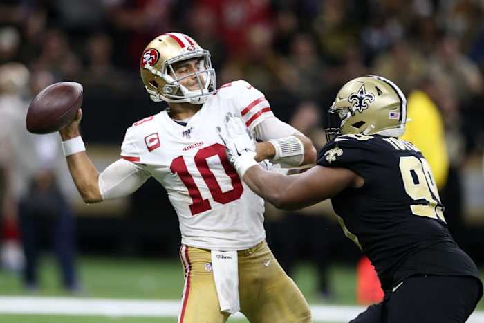 San Francisco 49ers quarterback Jimmy Garoppolo (10) is pressured by New Orleans Saints defensive tackle Shy Tuttle (99). Mandatory Credit: Chuck Cook-USA TODAY